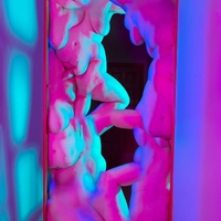 Composite image of  several morphed human bodies stacked on top on each other using vibrant colors